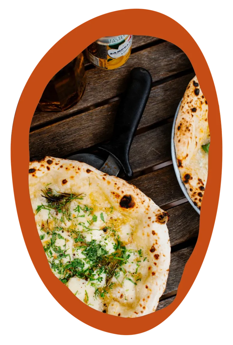 White pizza topped with herbs